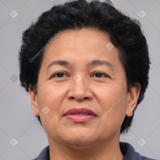 Joyful latino adult female with short  brown hair and brown eyes