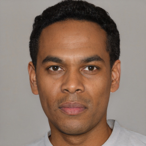 Neutral black young-adult male with short  black hair and brown eyes