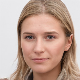 Joyful white young-adult female with long  brown hair and blue eyes