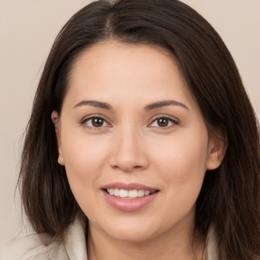 Joyful white young-adult female with medium  brown hair and brown eyes