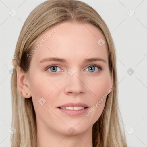 Joyful white young-adult female with long  brown hair and blue eyes