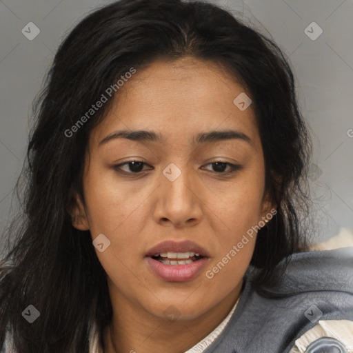 Joyful latino young-adult female with long  brown hair and brown eyes