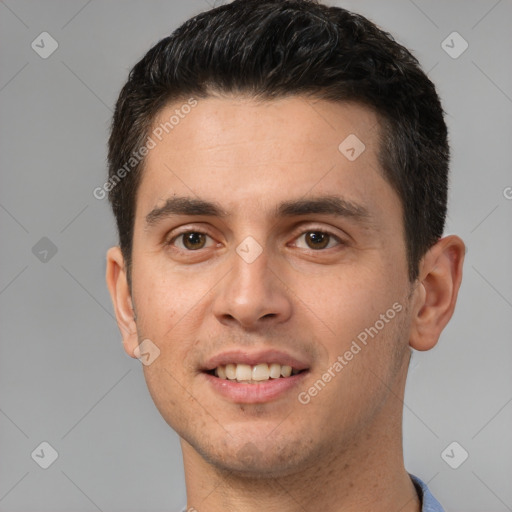 Joyful white young-adult male with short  brown hair and brown eyes