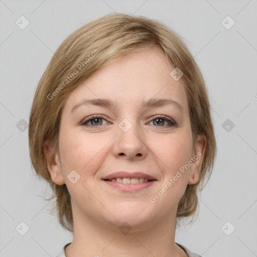 Joyful white young-adult female with medium  brown hair and grey eyes