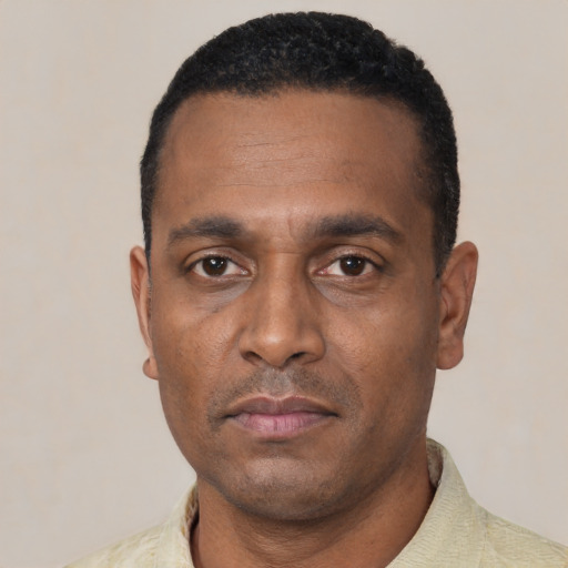 Neutral black adult male with short  black hair and brown eyes