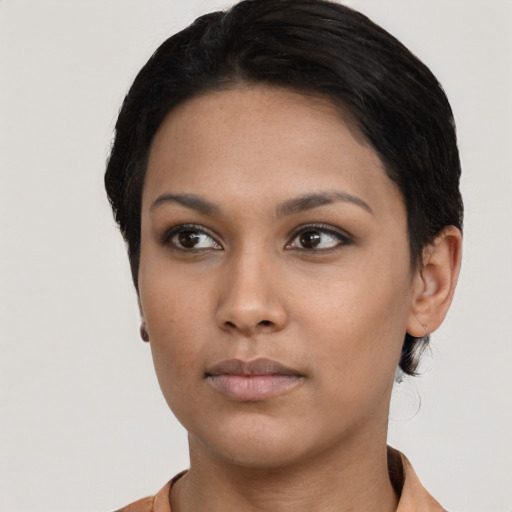 Neutral black young-adult female with short  black hair and brown eyes