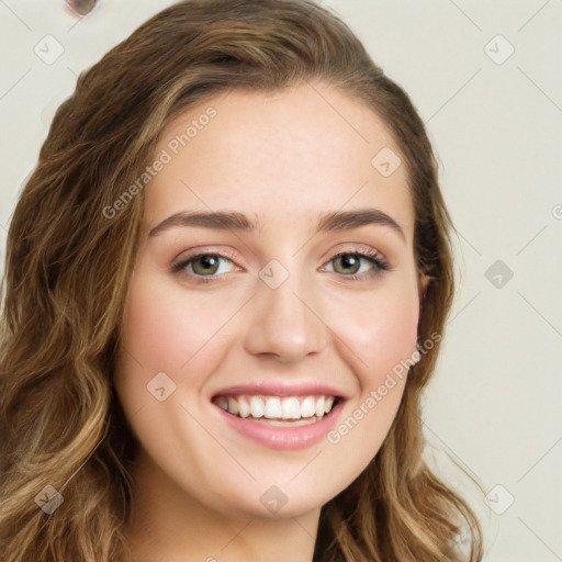 Joyful white young-adult female with long  brown hair and green eyes