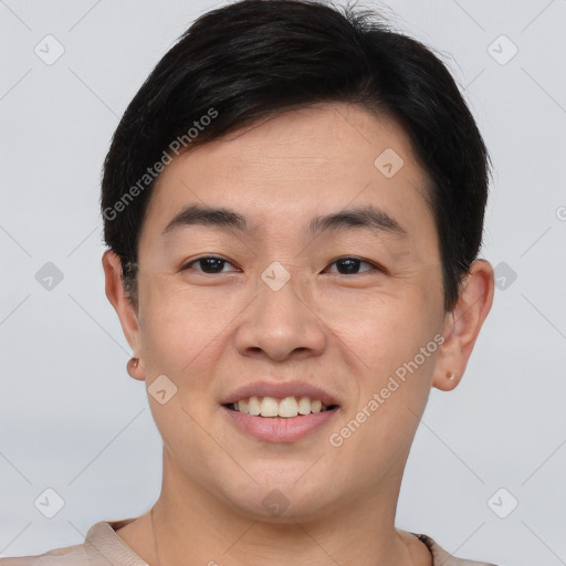 Joyful asian young-adult male with short  brown hair and brown eyes