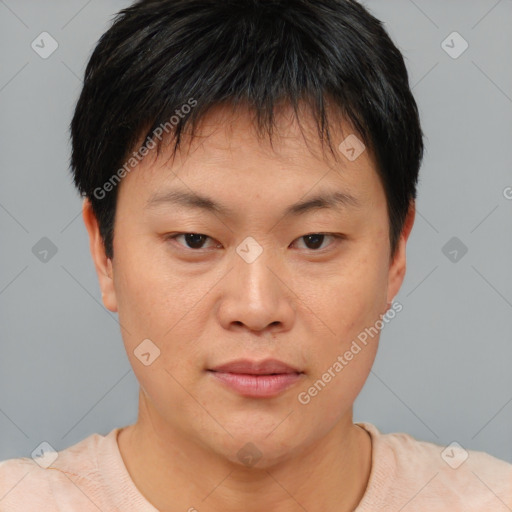 Joyful asian young-adult male with short  brown hair and brown eyes