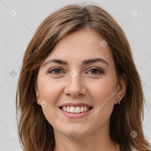 Joyful white young-adult female with long  brown hair and grey eyes