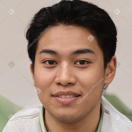 Joyful asian young-adult male with short  black hair and brown eyes