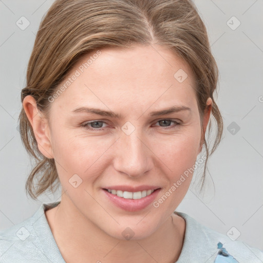 Joyful white young-adult female with medium  brown hair and blue eyes