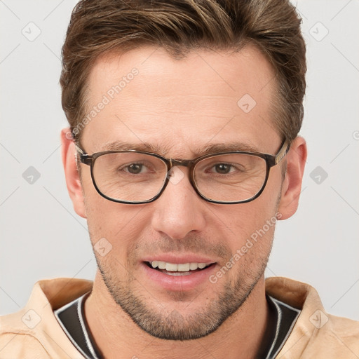 Joyful white adult male with short  brown hair and grey eyes