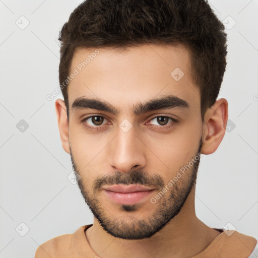 Neutral white young-adult male with short  brown hair and brown eyes