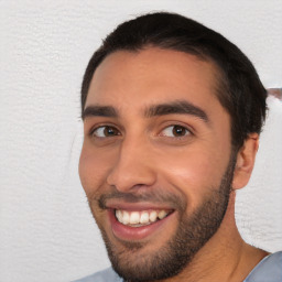 Joyful white young-adult male with short  black hair and brown eyes