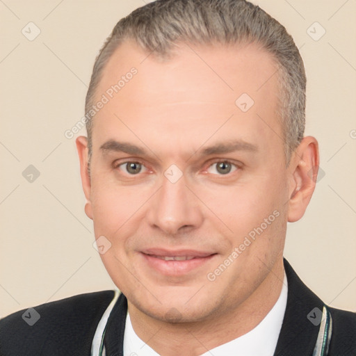 Joyful white adult male with short  brown hair and brown eyes