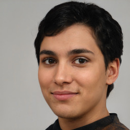 Joyful white young-adult male with short  black hair and brown eyes