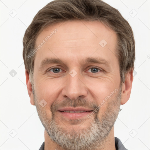 Joyful white adult male with short  brown hair and grey eyes