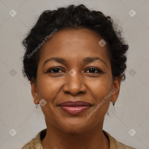 Joyful black adult female with medium  brown hair and brown eyes