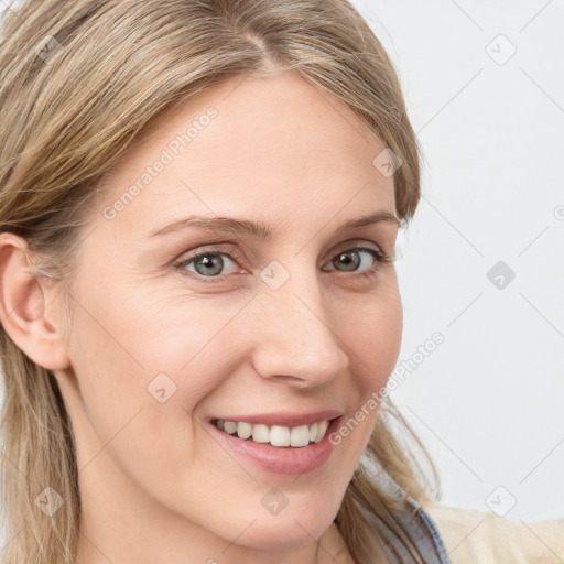 Joyful white young-adult female with long  brown hair and blue eyes