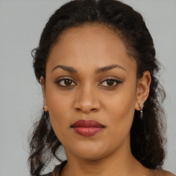 Joyful black young-adult female with medium  brown hair and brown eyes