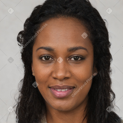 Joyful black young-adult female with long  brown hair and brown eyes