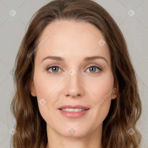 Joyful white young-adult female with long  brown hair and green eyes