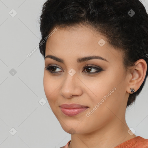 Joyful latino young-adult female with short  brown hair and brown eyes