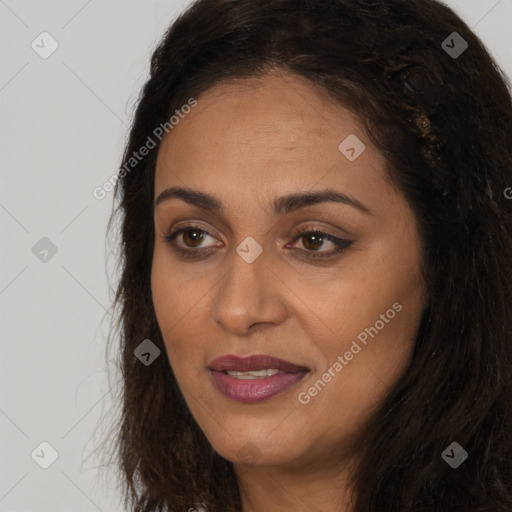 Joyful white adult female with long  brown hair and brown eyes