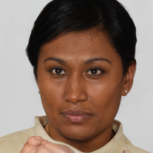 Neutral asian young-adult female with short  brown hair and brown eyes