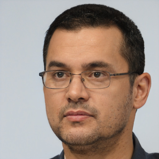 Neutral white adult male with short  black hair and brown eyes
