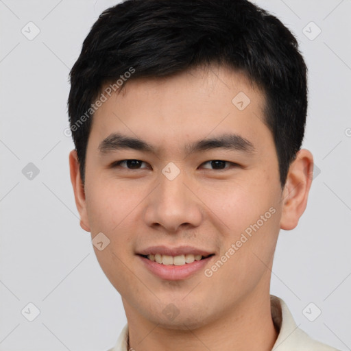 Joyful asian young-adult male with short  brown hair and brown eyes