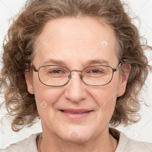 Joyful white adult female with medium  brown hair and blue eyes