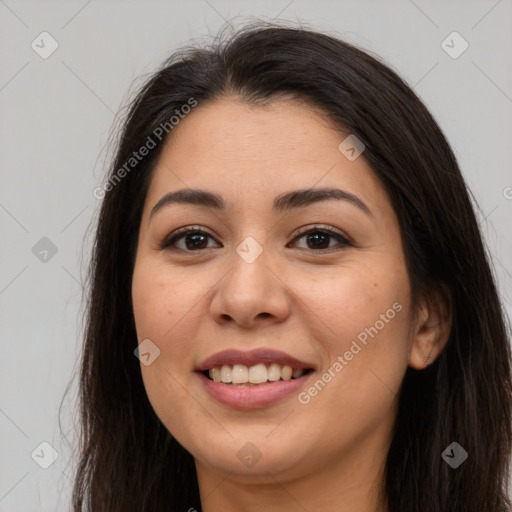 Joyful latino young-adult female with long  brown hair and brown eyes