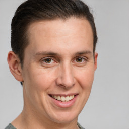 Joyful white adult male with short  brown hair and grey eyes