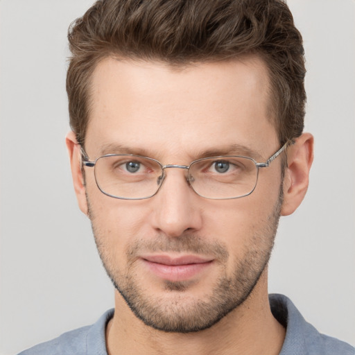 Joyful white adult male with short  brown hair and brown eyes