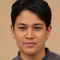 Joyful asian young-adult male with short  brown hair and brown eyes