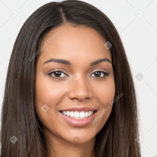 Joyful latino young-adult female with long  brown hair and brown eyes