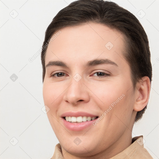 Joyful white young-adult female with short  brown hair and brown eyes