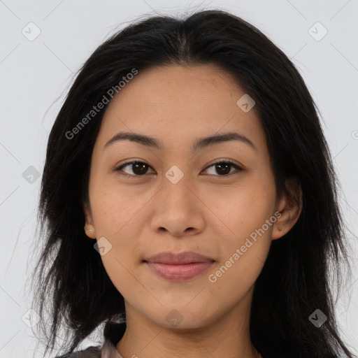 Joyful asian young-adult female with long  brown hair and brown eyes