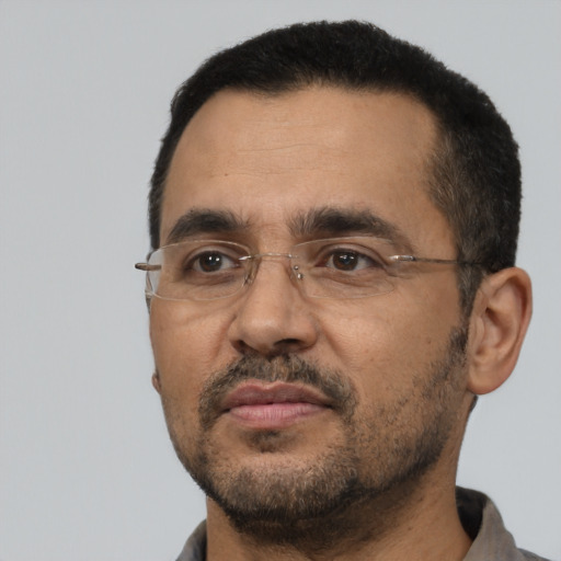 Neutral black adult male with short  black hair and brown eyes