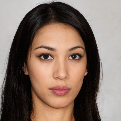 Neutral latino young-adult female with long  black hair and brown eyes
