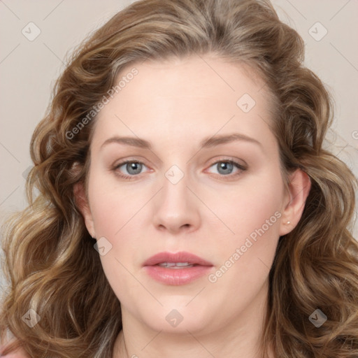 Joyful white young-adult female with long  brown hair and blue eyes