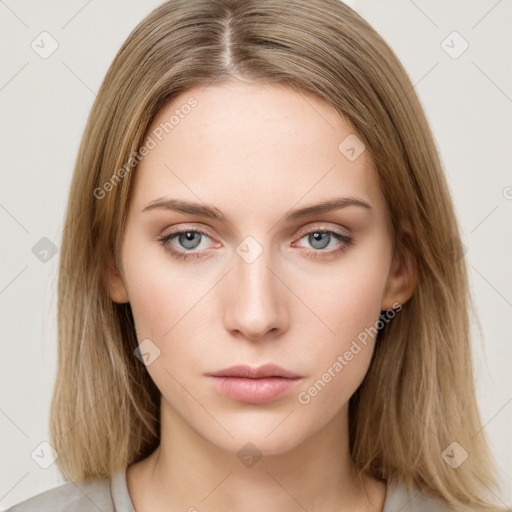 Neutral white young-adult female with long  brown hair and green eyes