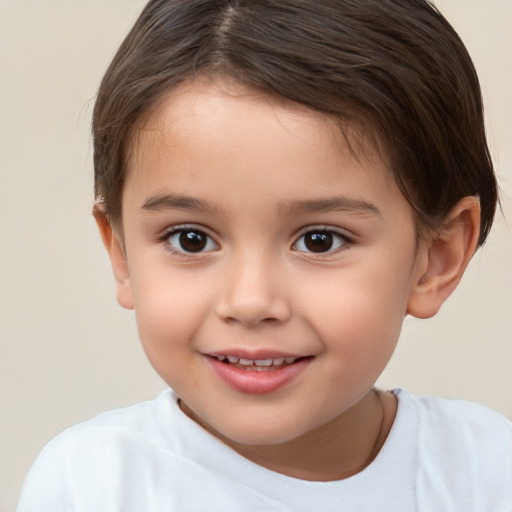 Joyful white child female with short  brown hair and brown eyes