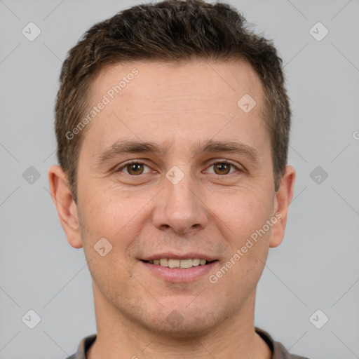 Joyful white adult male with short  brown hair and brown eyes