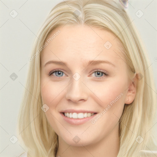 Joyful white young-adult female with long  brown hair and blue eyes