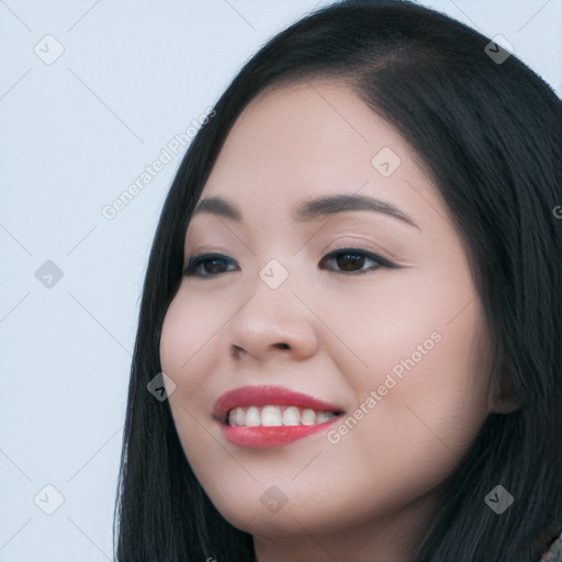 Joyful white young-adult female with long  black hair and brown eyes