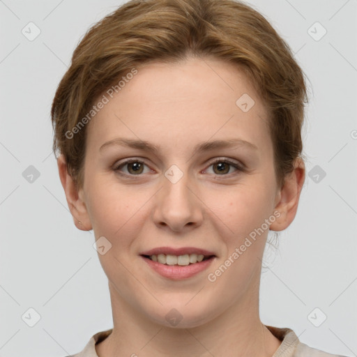 Joyful white young-adult female with short  brown hair and grey eyes