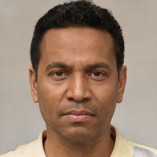 Neutral latino adult male with short  black hair and brown eyes